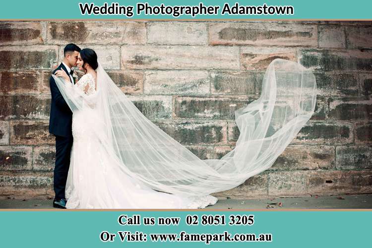 A romantic photo shot of the Groom and his Bride kissing Adamstown NSW 2289