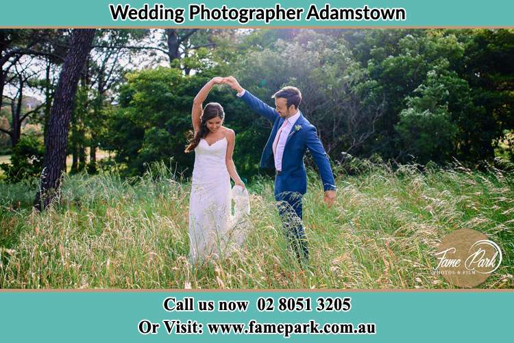 Photo of the Groom and the Bride dancing on the fields Adamstown