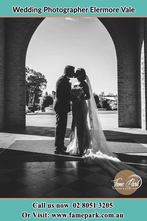 Photo of the Groom and the Bride kissing Elermore Vale NSW 2287