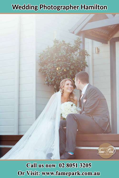 Romantic photo of the Bride and the Groom sitting and looking each other Hamilton NSW 2303