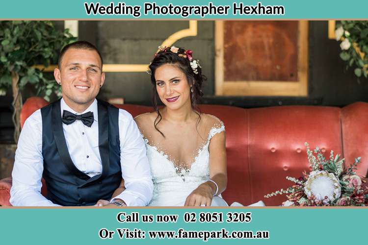 Photo of the Groom and the Bride sitting a pose Hexham NSW 2322