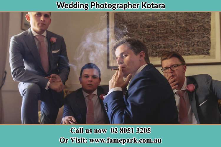 Photo of the Groom smoking with his groom men Kotara NSW 2289