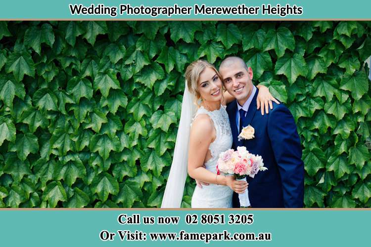 The Bride and the Groom happily pose for the camera Merewether Heights