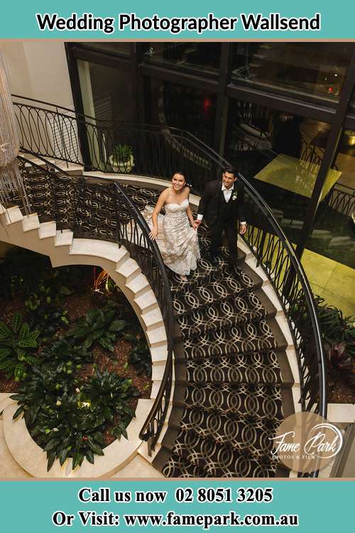 Photo of the Bride and the Groom going down the stairs Wallsend NSW 2287